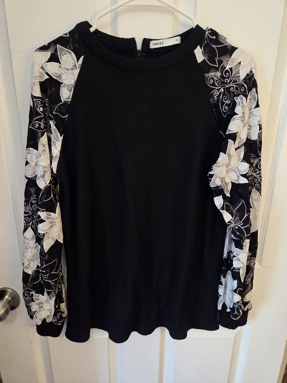 Miholl Black Knit Top with White Floral Lace Sleeves